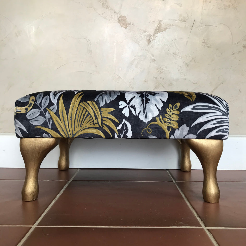 Black and store gold ottoman stool